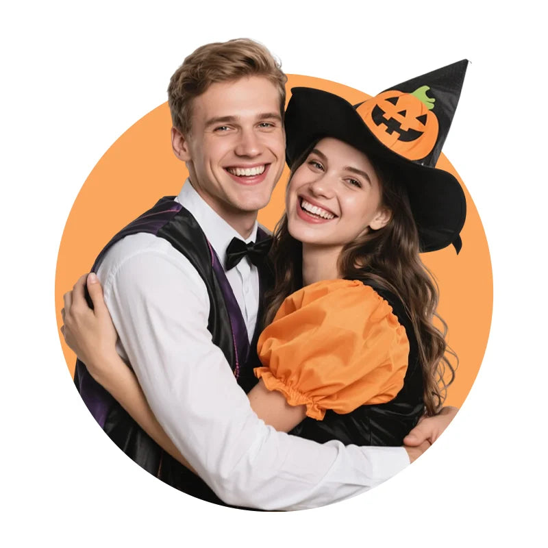 Couple hugging—woman in a black Halloween witch hat with pumpkin detail, man in a formal vest—set against an orange background.