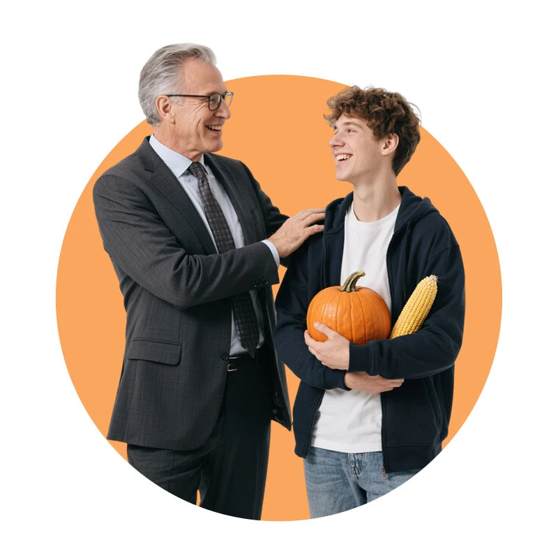 Smiling teacher and student with pumpkin and corn in orange circle, showcasing custom educational gift ideas | PrintToucan