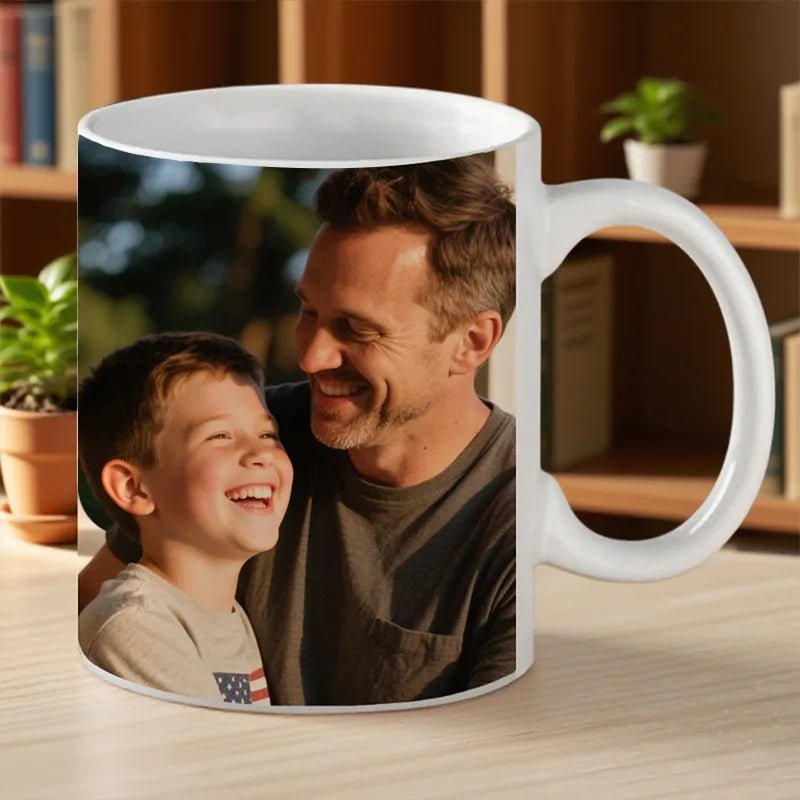 Custom Mug 12oz Photo Gift for Father's Day PrintToucan - A father and son, in a cozy room with plants, laugh together on the mug.