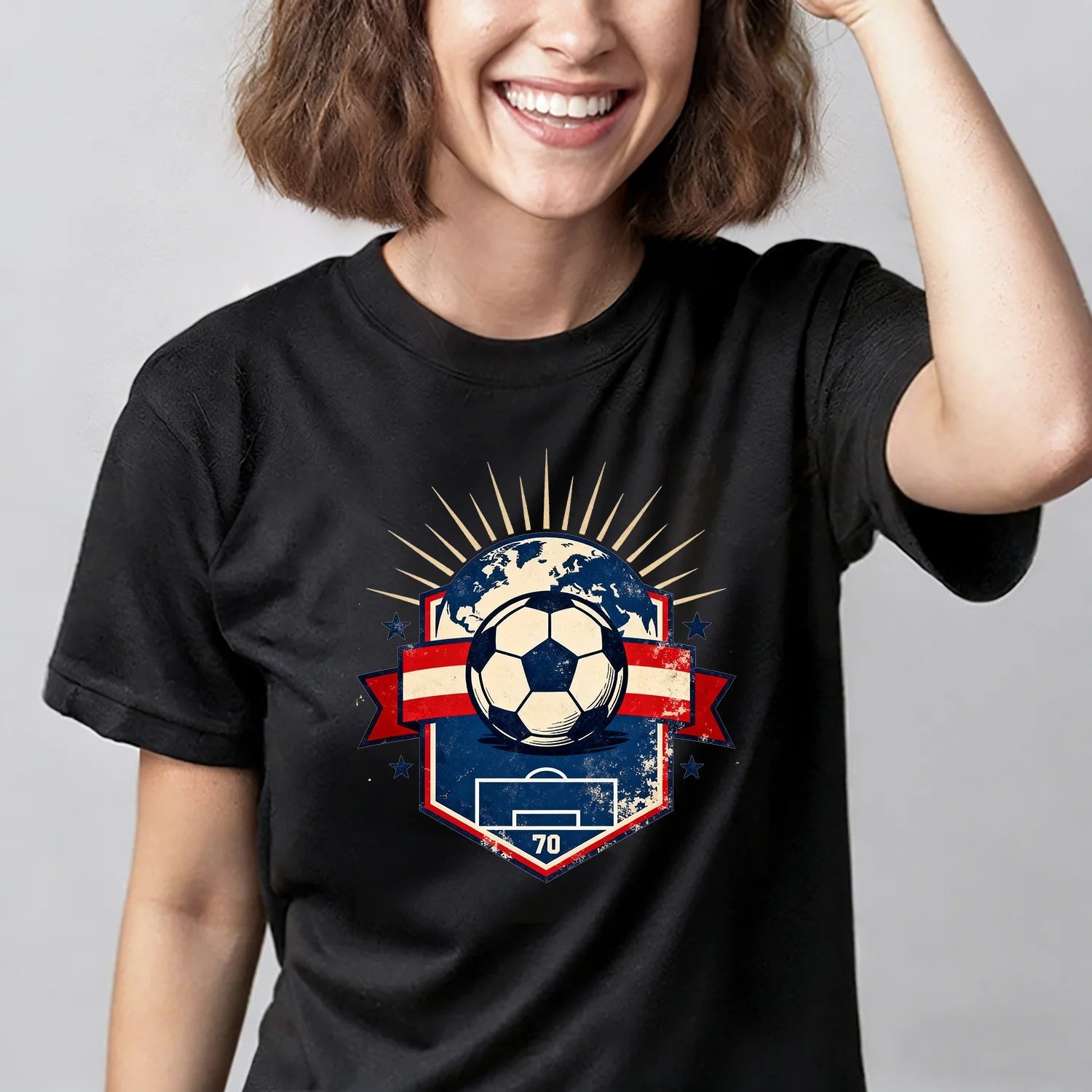Elevate your everyday look with this black soccer t-shirt. The classic distressed crest design makes it a go-to for any football fan.