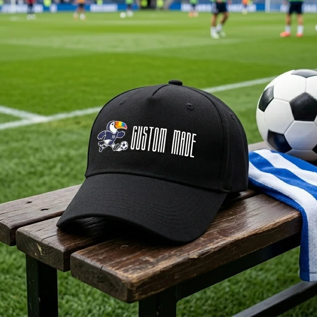 Show your team pride with this custom baseball cap! Featuring our playful toucan mascot in soccer gear and personalized text, it’s the perfect game-day accessory.